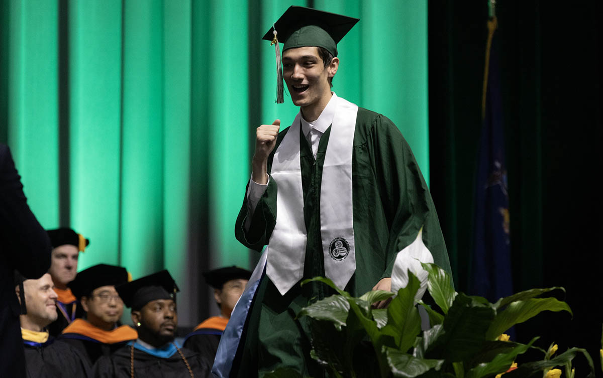 A graduate celebrates after earning his bachelor's degree at the 2026 Commencement ceremony for Binghamton University's Thomas J. Watson College of Engineering and Applied Science.