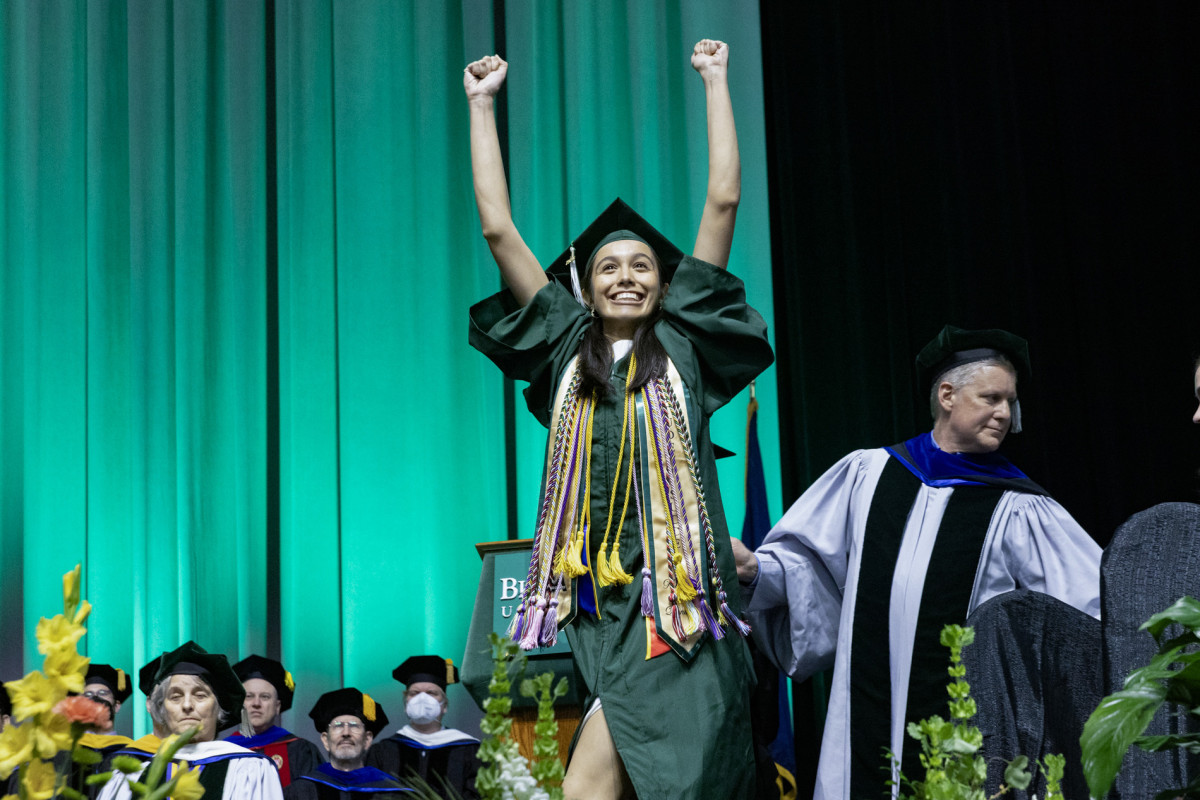 A student celebrates during Harpur College's second Commencement ceremony.
