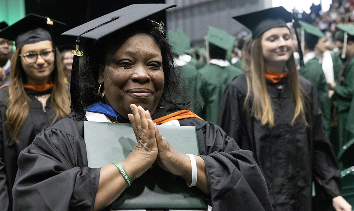 A graduate celebrates after earning her master's degree at the 2026 Commencement ceremony for Binghamton University's Thomas J. Watson College of Engineering and Applied Science.