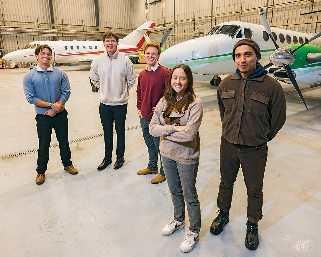 From left, Nicholas Ingraselino, Justin Mintz, Ben Deibler, Lilly Guizatoullina and Gerardo Dutan checked out an airplane hangar at the Greater Binghamton Airport.