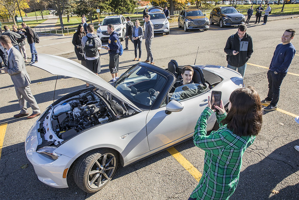 Seven alumni and several executives from Mazda Motors visited Binghamton to launch the live case analysis for all of the juniors enrolled in Marketing 311 through the School of Management.