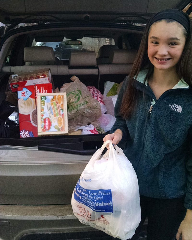 Alexis Green in 2015, transporting donated items to the food pantry.