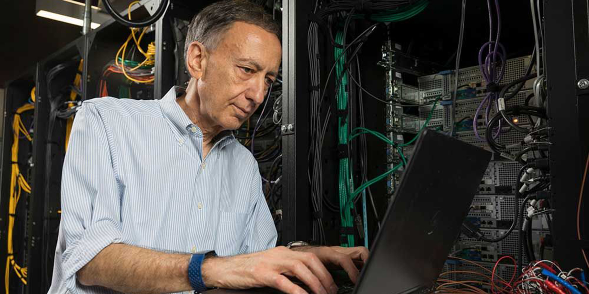 Bahgat Sammakia, vice president for research, works in the data center lab at the Center of Excellence Building.