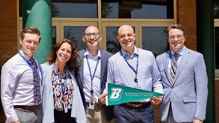 Blind Brook-Rye Union Free School District administrators and Binghamton University graduates (from left) Jim Quigley, Tracy Taylor, Seth Horowitz, Mark Greenwald, and Brian Alm display their Binghamton pride while standing outside Blind Brook High School in Westchester County, New York.