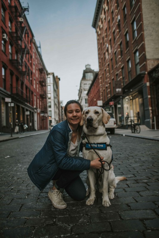 Biological sciences major Yfke Havinga and Stan, a guide dog in training, in New York City.