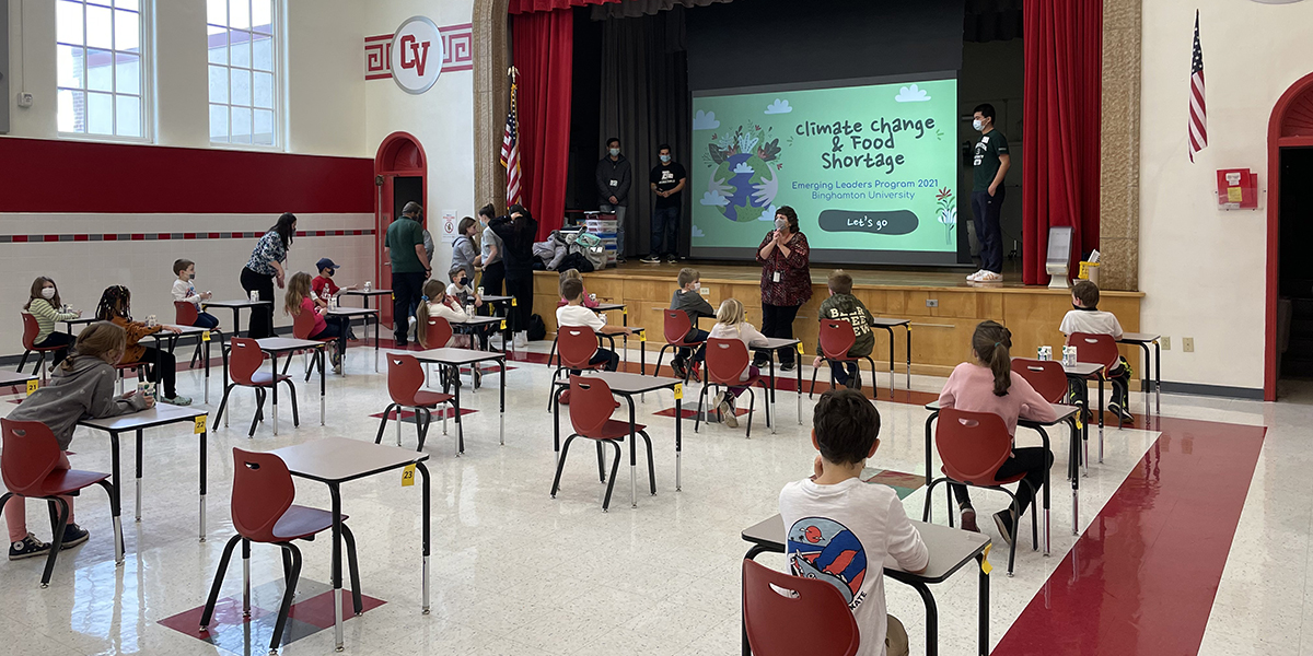Students in Binghamton University's Emerging Leaders Program Environment and Ecology Knowledge Community presented to Chenango Valley elementary students on climate change and food shortages.