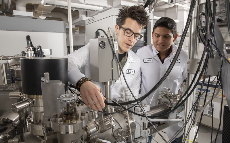 Graduate students Christopher Singh, left, and Galo Paez Fajardo are assisting Louis Piper and Wei-Cheng Lee on the project.