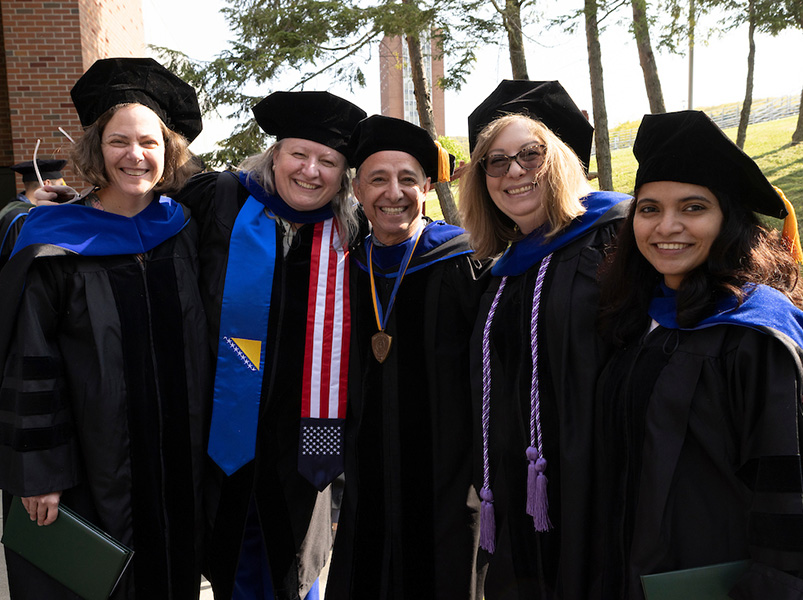 Decker College students who graduated with a PhD in Nursing were celebrated during Binghamton's Doctoral Degree Ceremony on May 10. Pictured from left to right are Kristin Pullyblank, Denisa Talovic, Serdar Atav (Decker College professor of nursing), Stacey Marye and Rini Chennattu.