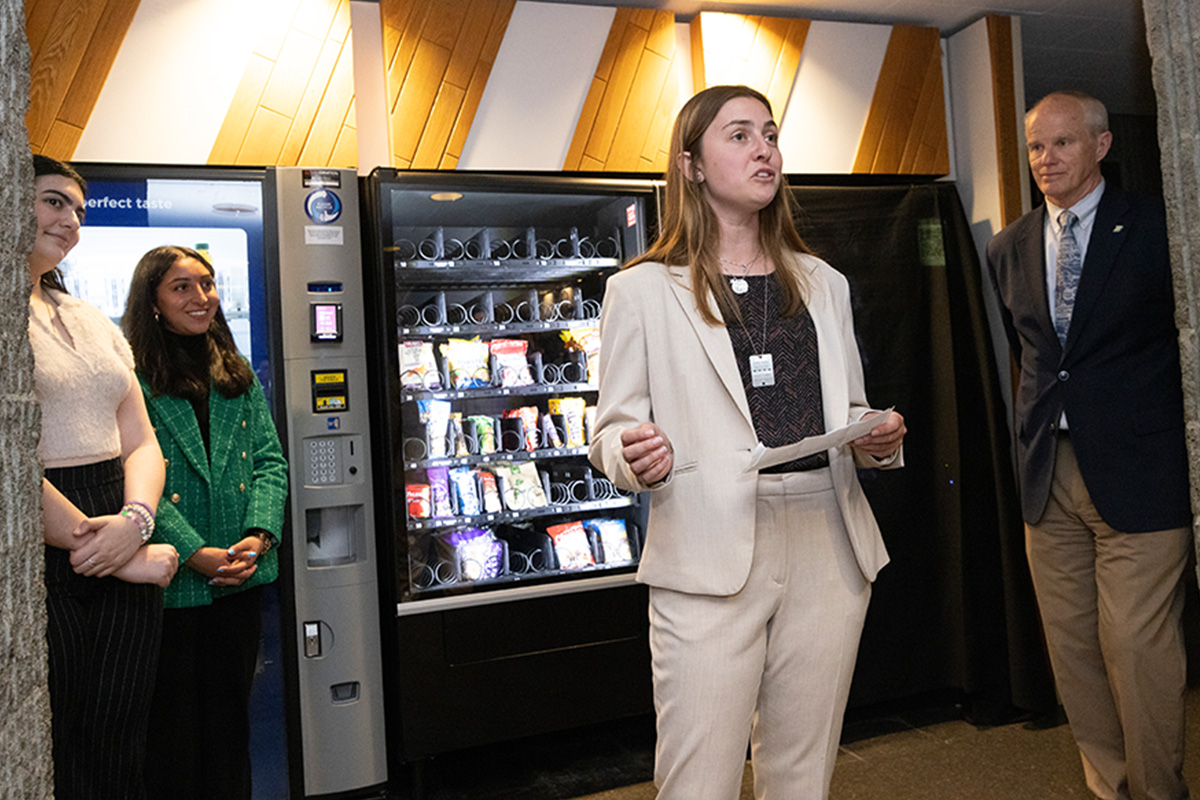 Binghamton University Road Map intern Mia Raskin speaks to fellow students for the unveiling of a 24/7 emergency contraceptive vending machine in the basement of the Glenn G. Bartle Library.