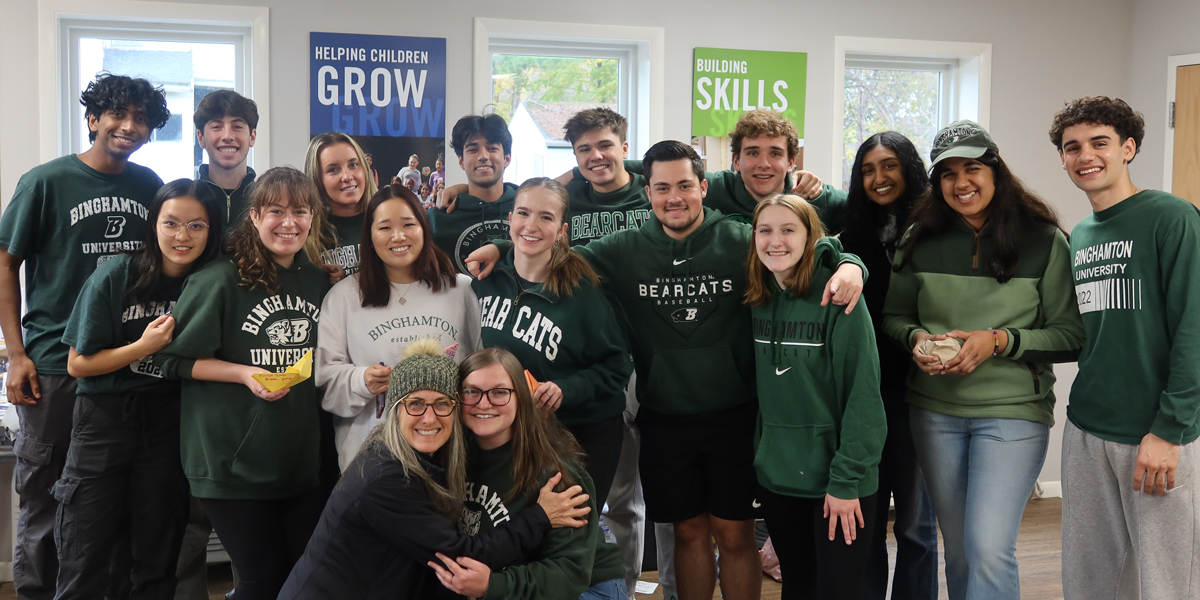 Students involved in the Emerging Leaders Program sports recreation and wellness knowledge community guiding physical and mental wellness activities for local youth at the Lee Barta Community Center in Binghamtom.