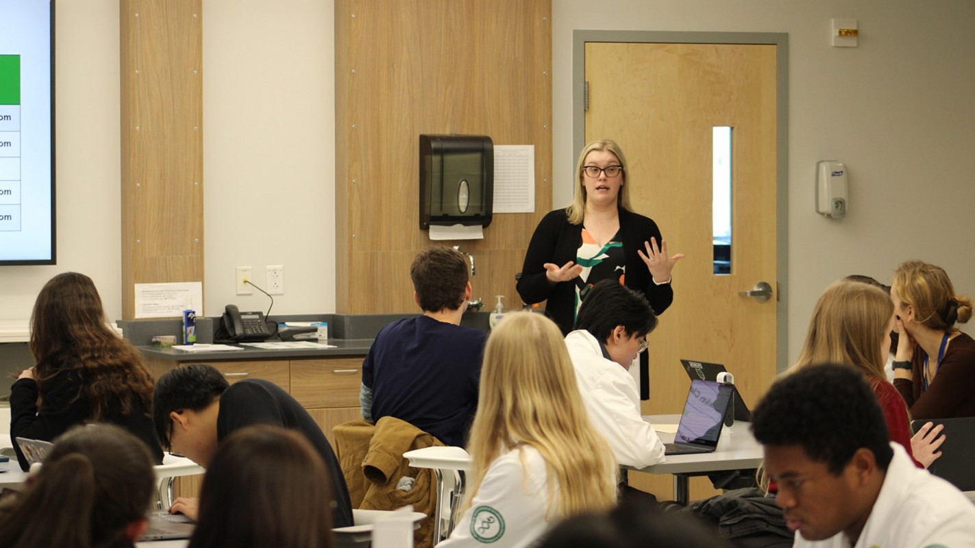 Clinical Associate Professor of Pharmacy Practice Emily Leppien explains to the students about the purpose of the training and how the activity will go.