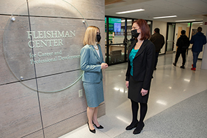 Kelli K. Smith, left, who served as Fleishman Center director from 2014-2017, and Denise Lorenzetti '94, MBA '97, the current director, talk outside of the center in the University Union.