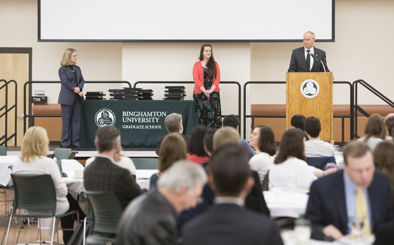 President Harvey Stenger salutes the recipients at the Graduate Excellence Awards ceremony on March 28.