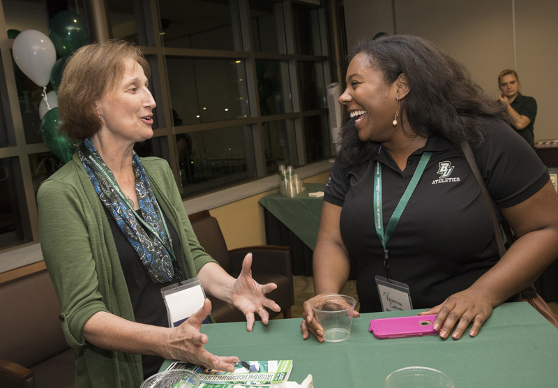Marilyn Gaska, MS '85, PhD '99 and Valentina Condrington, Harpur '12 SOM '14, mingle at the  Homecoming 2017 opening reception at the Alumni Center in Old O'Connor Hall on Oct. 6.