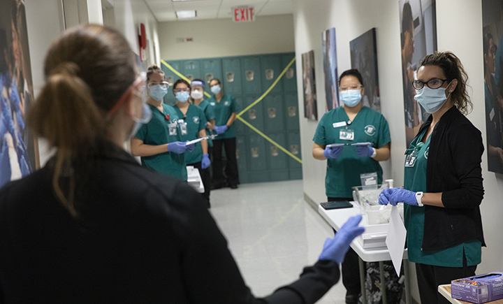 Lori Sprague, assistant director of the ISPC, goes over the practice session guidelines before she and the students enter the practice lab.