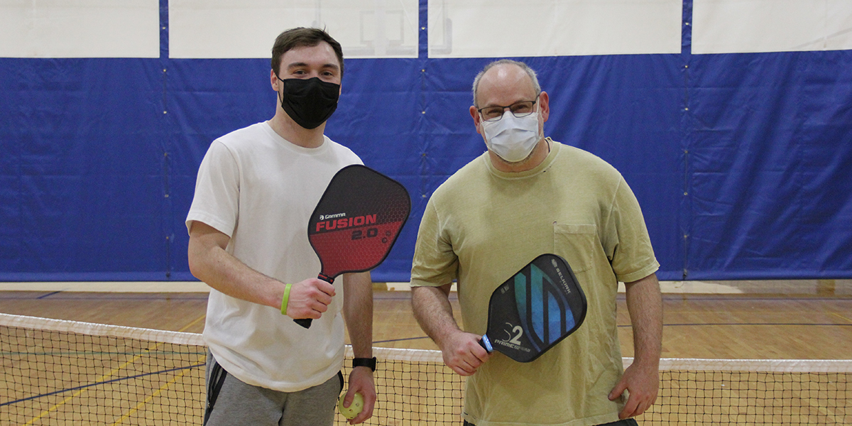 Grad student Mercury Mason, left, and Professor of Psychology Kenneth Kurtz teamed up and won the Intramural Pickleball Tournament this spring.