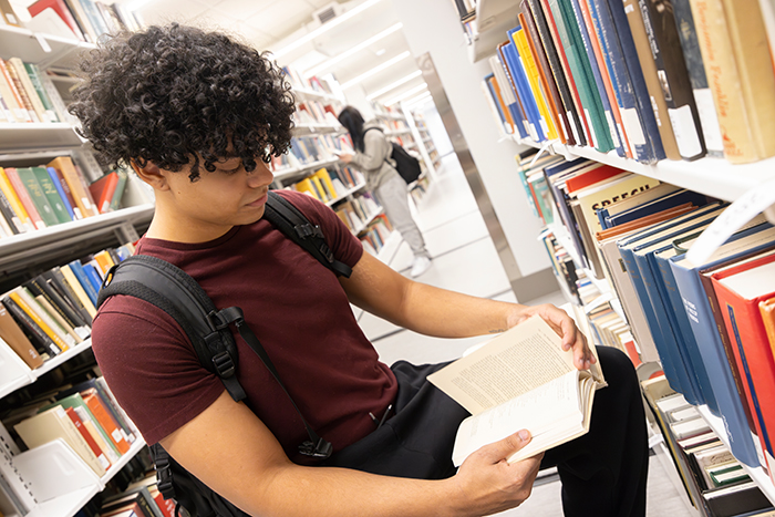 Students look at books on the new third floor of the Glenn G. Bartle Library.