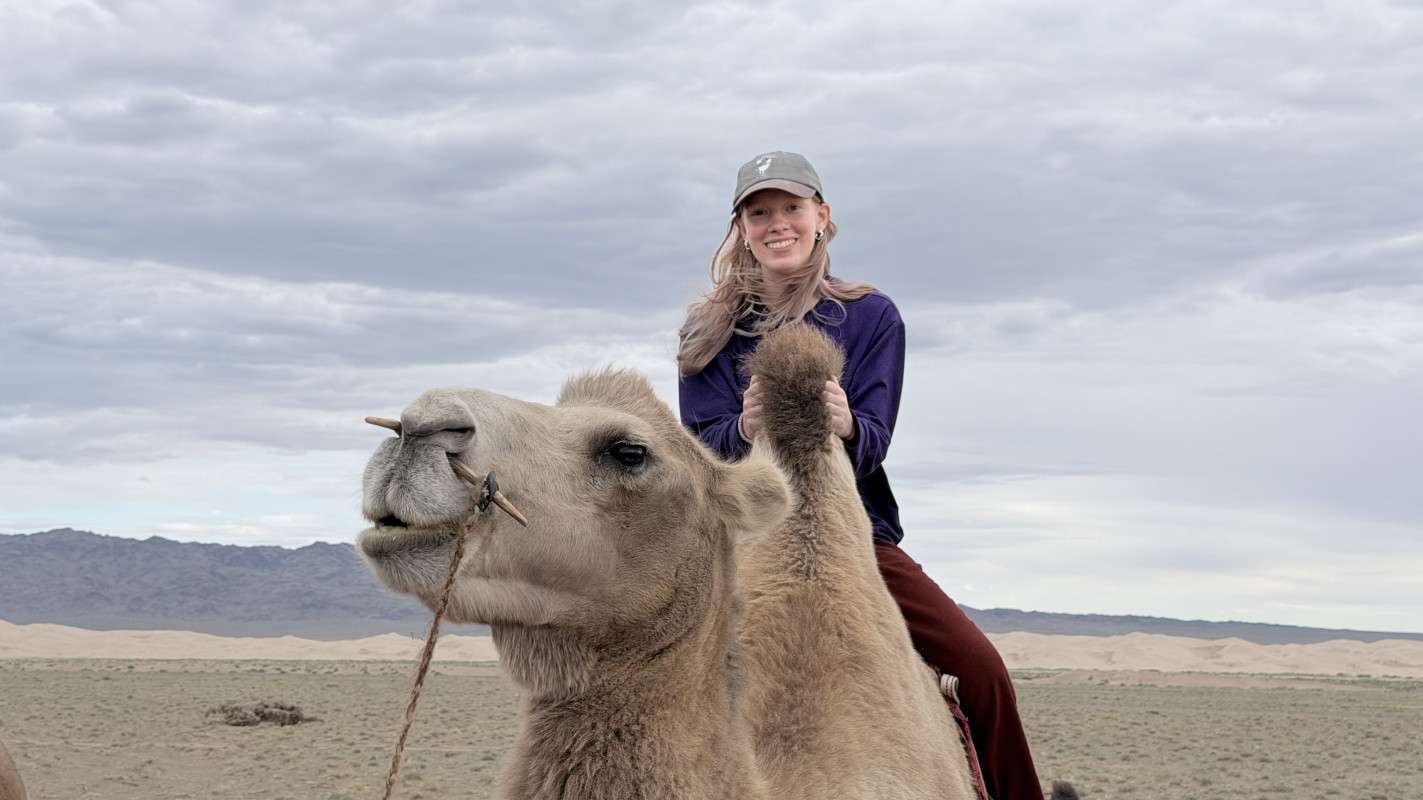 Sophomore Matilda Fillion rides a camel in the Gobi Desert.