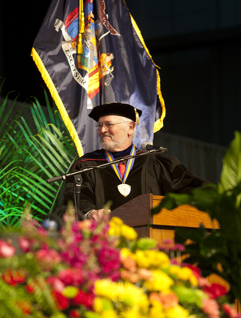 Michael McGoff was a constant presence on the Commencement stage, reading the names of new Binghamton University graduates.