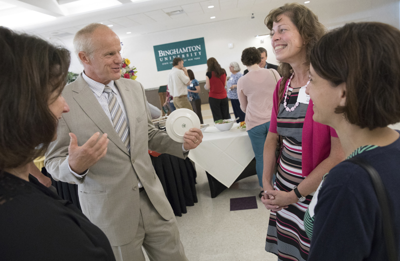 President Harvey Stenger speaks with Patricia Gabriel, left, of the Graduate School, and Laura McDuffee and Joanna Cotten of the School of Pharmacy and Pharmaceutical Sciences at the New Faculty and Staff Reception held Sept. 20 at Old Union Hall.