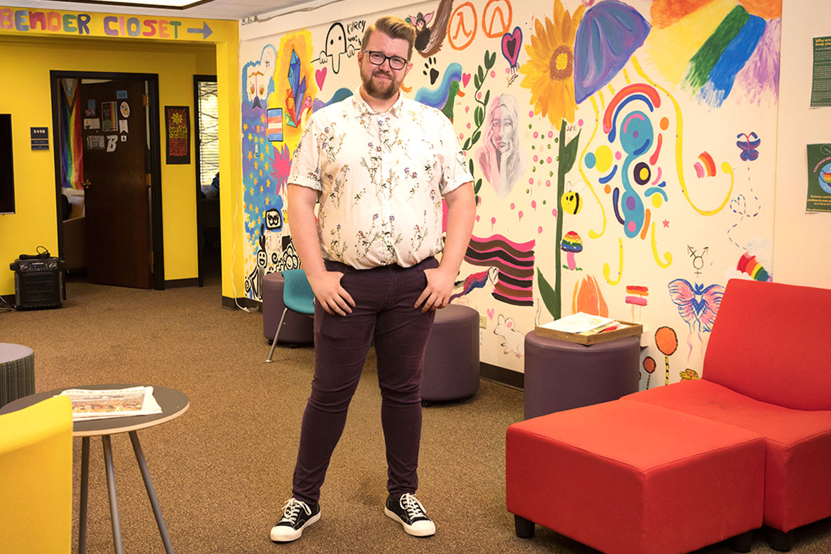 Nicholas Martin, assistant director, stands in the Q Center's main lounge area.