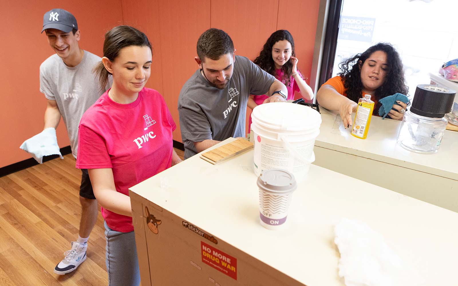 Students in the Binghamton University School of Management's PwC Scholars help spruce up the headquarters of Truth Pharm, a nonprofit organization in Binghamton, N.Y. that advocates for policy changes to reduce the harms caused by substance use.