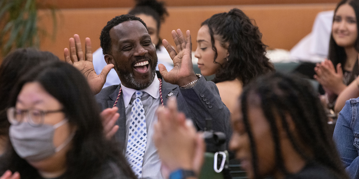 Randall Edouard, the dean of students who was hooded with his doctorate from Binghamton University in May, spoke at and immersed himself in the celebration during the University's first-ever, first-generation cording ceremony, spearheaded by the BFirst Network.