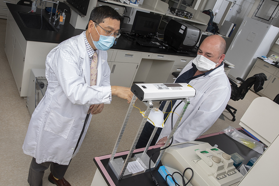 Kaiming Ye, left, professor and chair of biomedical engineering, and Guy German, associate professor of biomedical engineering, received a National Science Foundation grant to develop a system that uses ultraviolet light to sterilize personal protective equipment.