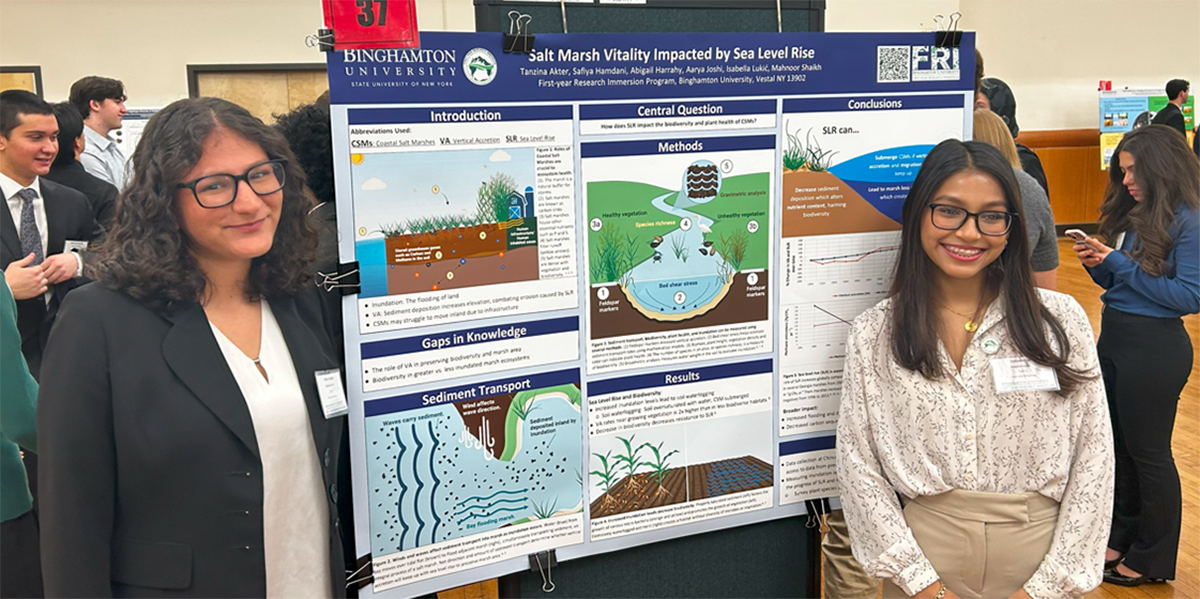 EOP student, Tanzina Akter (right) and her classmate present their research at the First-year Immersion Program poster session in December 2024.