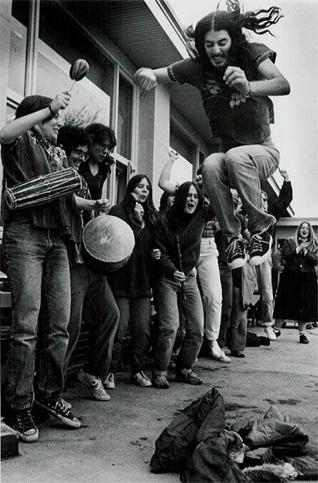 A Binghamton University student stomping on the coat during the annual ceremony.