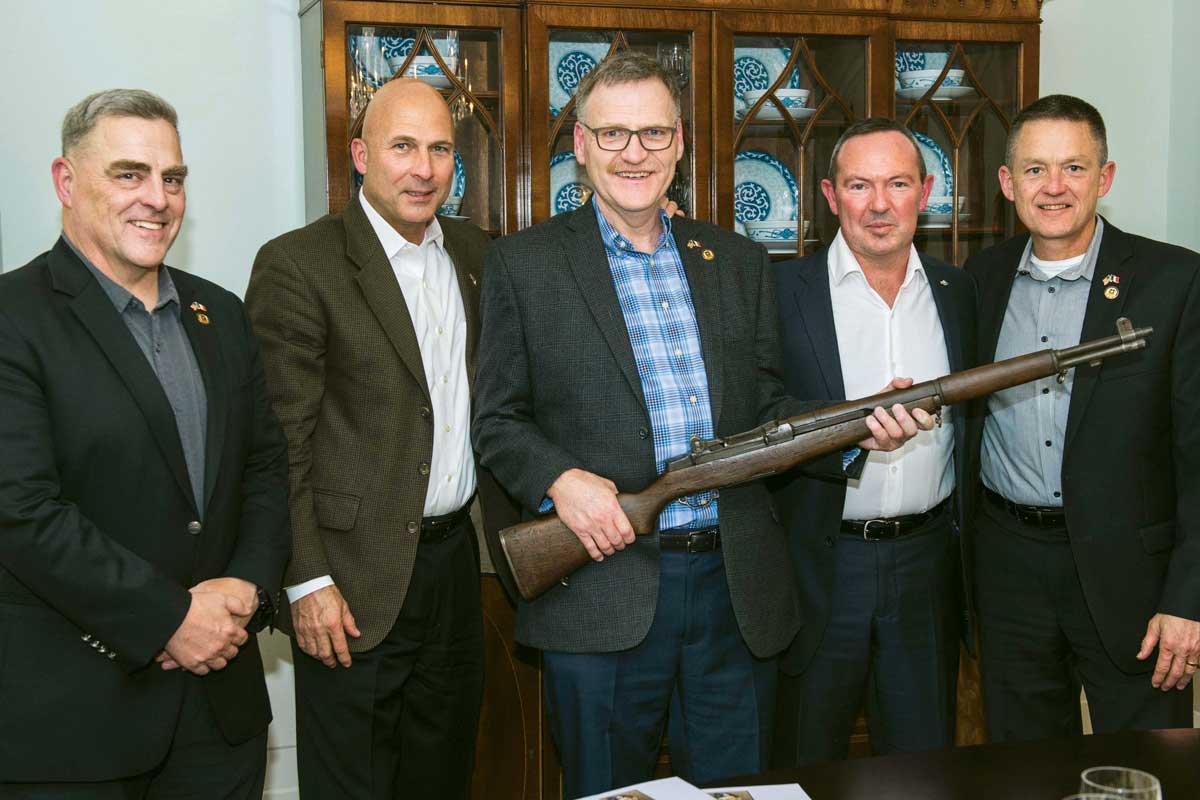 From left, U.S. Army Chief of Staff Gen. Mark A. Milley, Gen. Joe Anderson, Jim Farrell, French Army Chief of Staff Gen. Jean-Pierre Bosser and Vice Chief of Staff Gen. Daniel Allyn at a state dinner in Milley’s quarters, where Martin Teahan’s rifle was presented to Farrell by Bosser.