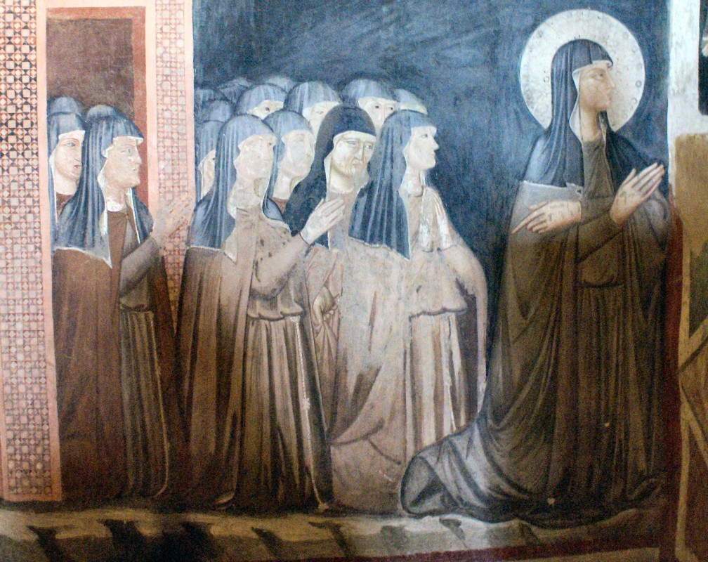 A fresco of Clare of Assisi and nuns of her order in the Chapel of San Damiano.