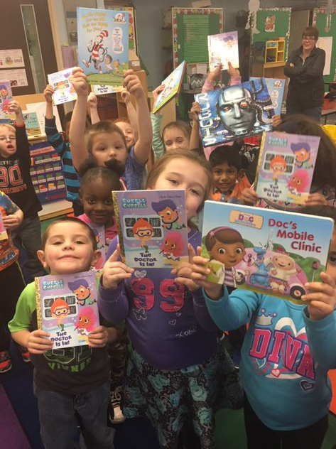 Watson students delivered nearly 600 books and school supplies to students at Theodore Elementary on Dec. 9.