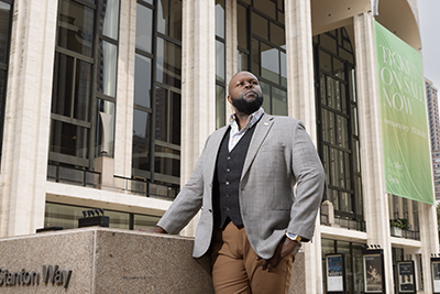 Tshombe Selby stands outside the Metropolitan Opera House at Lincoln Center in New York City.
