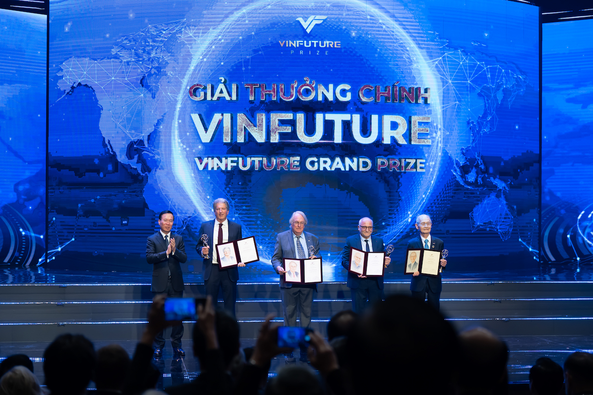 Binghamton University professor and Nobel Laureate M. Stanley Whittingham, center, stands onstage with fellow VinFuture Grand Prize winners at a ceremony on Dec. 20, 2023.
