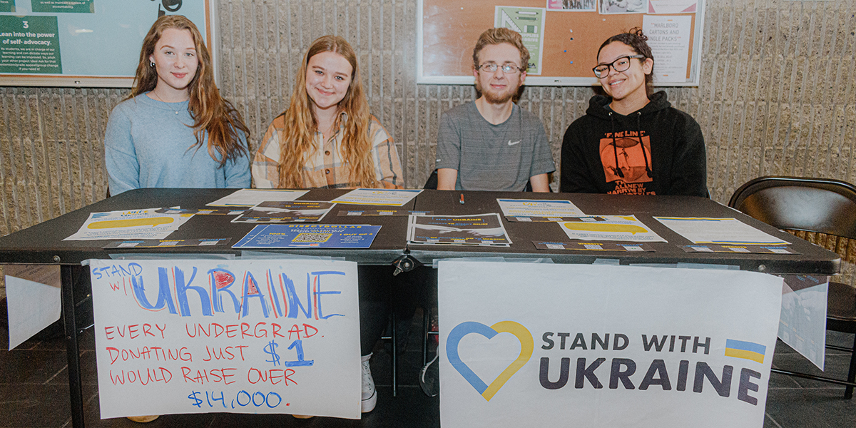 Students from the Public Service Learning Community are tabling to raise $14,000 for Ukraine relief. From left, Gizela Maksym, Sophia Myshchuk, Steven Iannone and Tara Delcarmen.