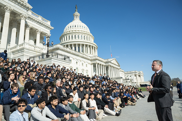 U.S. Rep. Eugene Vindman '97 speaks to visitors outside the U.S. Capitol. The U.S. Army veteran won election to Congress in 2024.