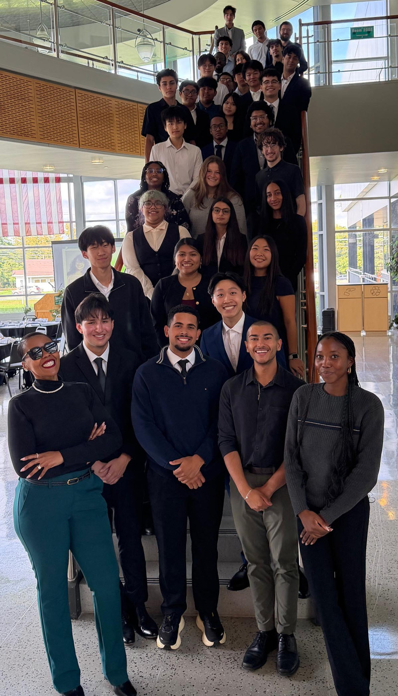 Students in all cohorts of the Watson College Scholars Program gathered for a group photo with Watson Office for Excellence in Diversity, Equity, and Inclusion Director Christina Toulon and Assistant Director Richard Quiles after a welcome luncheon on Sept. 30.