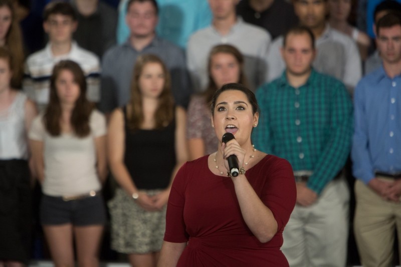 Caitlin Gotimer, then an undergraduate, performs the national anthem during President Barack Obama's visit to campus in 2013.