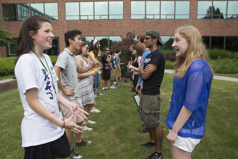 Freshman students use an ice breaker to get to know each other during an Orientation session.