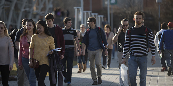 Students walking to classes on the Lois B. DeFleur Walkway.