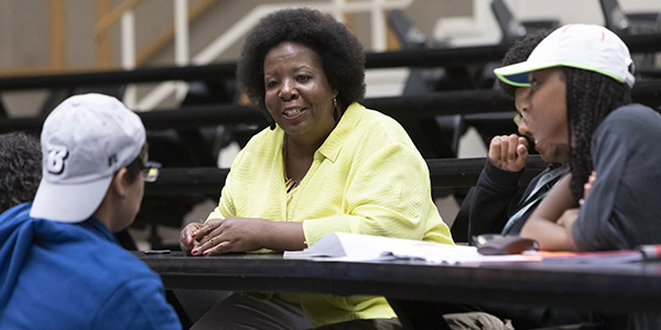 Denise Yull, associate professor of human development, works with students.