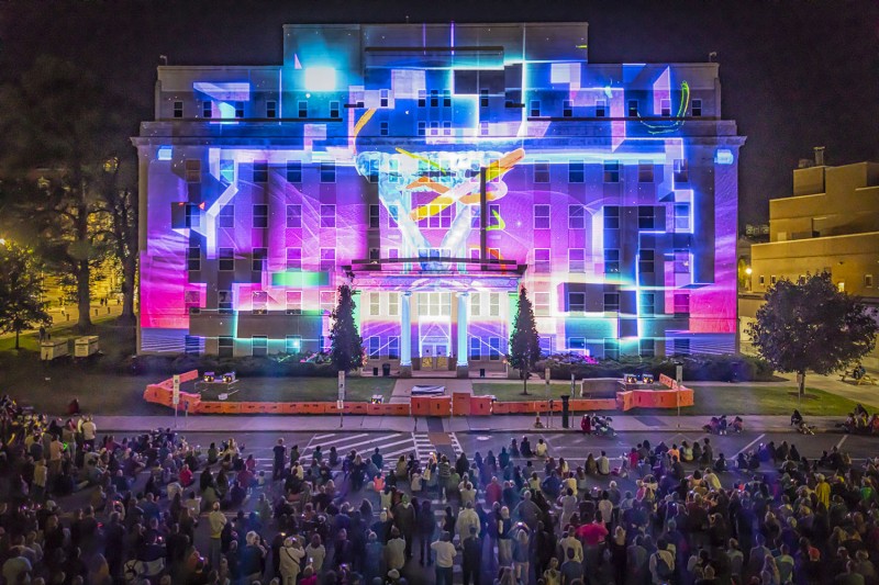 The LUMA Projection Arts Festival features a variety of colorful light shows projected on top of downtown Binghamton buildings.
