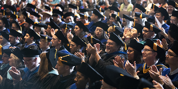 Doctoral candidates and their faculty advisors during the 2019 Doctoral Hooding Ceremony, held Wednesday, May 15, at the Osterhout Concert Theater in the Anderson Center for the Performing Arts.