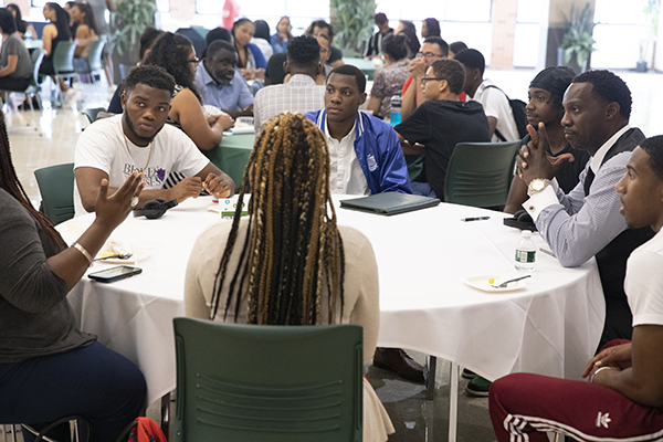 Students of color had the opportunity to meet and connect with faculty, staff and each other at the third annual New Student of Color Networking Event held Aug. 22. Randall M-J Edouard, assistant vice president for student affairs and interim dean of students, far right, leads a discussion.
