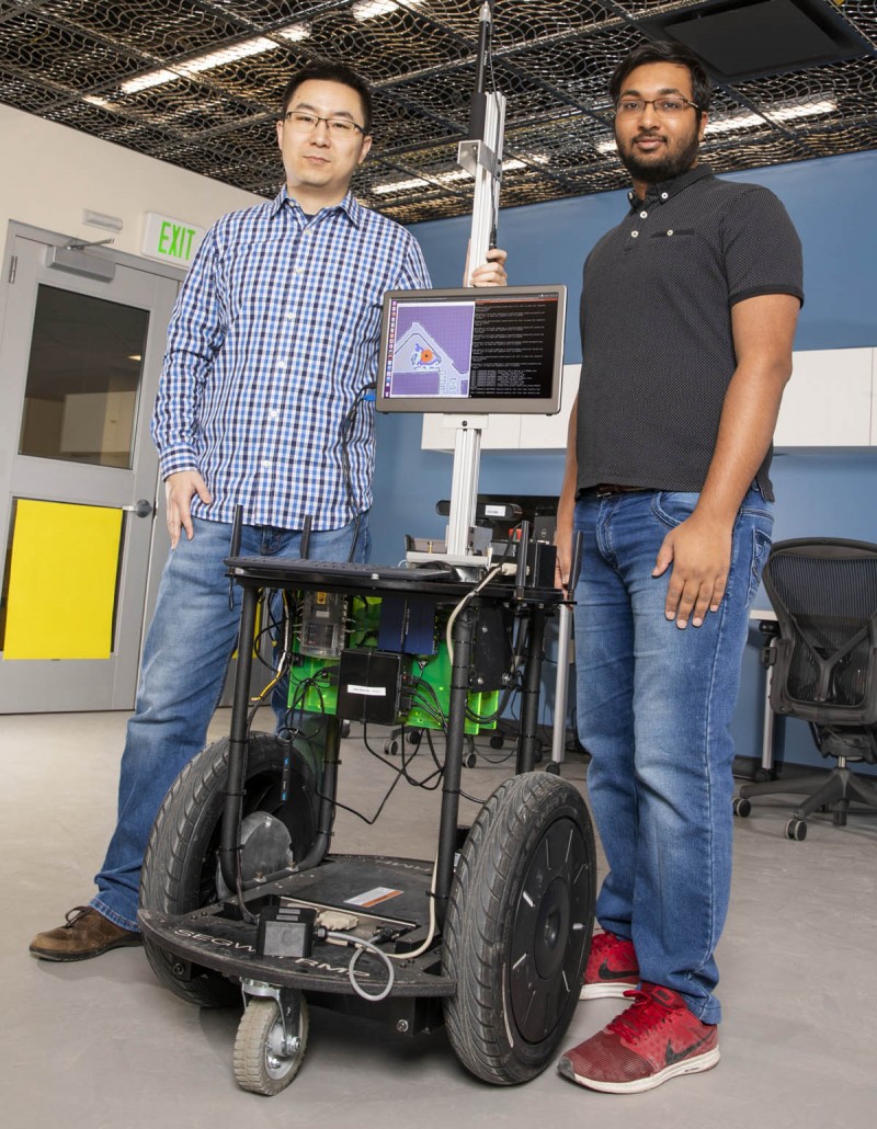 Assistant Professor Shiqi Zhang, left, and PhD student Kishan Chandan developed the ARROCH system alongside others at Zhang's Autonomous Intelligent Robotics Lab.
