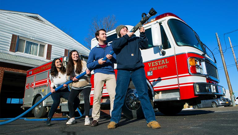Watson School seniors, from left, Katherine Frey, Audrey Nieuwenhuizen, Brian Walsh and Mikayla Morgan completed a capstone project on fire hoses to earn their mechanical engineering degrees.