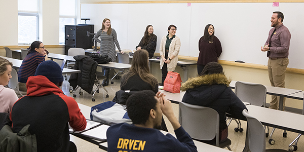 Sam Kipp, Katie Monahan, Mar Santos, Kaitlyn Annal, all Residential Life MSW interns, and JJ Brice, associate director of operations and crisis for Residential Life, speak in February to first-year Master of Social Work students who are interested in interning with the program next year.