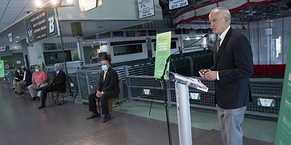 Binghamton University President Harvey Stenger speaks during a news conference Aug. 12, held at the University's Events Center, while other speakers sit socially distanced prior to their turn at the podium.