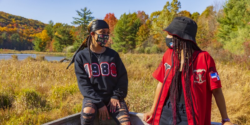 Arianna Mendoza (left) spends time in the Nature Preserve with Jaylene Tejada, a fellow member of Chi Upsilon Sigma National Latin Sorority Inc.